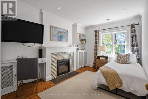 23 Cornish Road, Toronto, ON - Indoor Photo Showing Bedroom With Fireplace