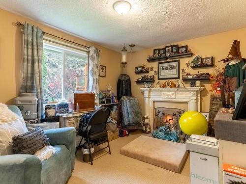 3772 Westsyde Rd, Kamloops, BC - Indoor Photo Showing Living Room With Fireplace