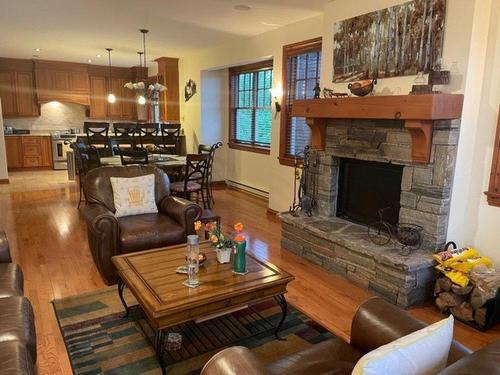 Overall view - 360 Allée De L'Aventure, Mont-Tremblant, QC - Indoor Photo Showing Living Room With Fireplace