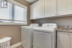 Upper level gas dryer & washer with sink & cabinet - 