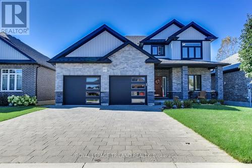 High end garage doors - 185 Spencer Avenue, Lucan Biddulph (Lucan), ON - Outdoor With Facade