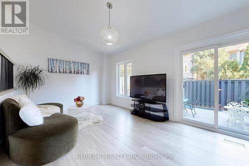 566 Sandhurst Circle, Toronto, ON - Indoor Photo Showing Living Room