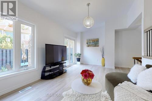 566 Sandhurst Circle, Toronto, ON - Indoor Photo Showing Living Room