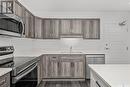 306 2641 Woodbridge Drive, Prince Albert, SK  - Indoor Photo Showing Kitchen With Double Sink 