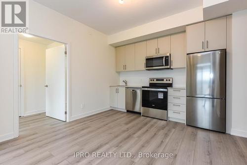 407 - 1440 Clarriage Court, Milton, ON - Indoor Photo Showing Kitchen With Stainless Steel Kitchen