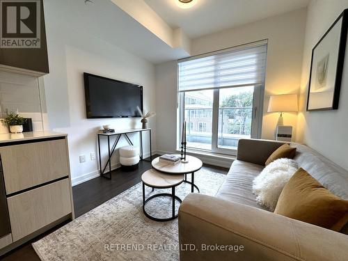 434 - 150 Logan Avenue, Toronto, ON - Indoor Photo Showing Living Room