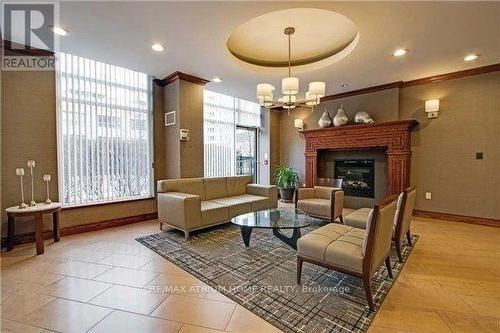 106 - 19 Barberry Place, Toronto, ON - Indoor Photo Showing Living Room With Fireplace