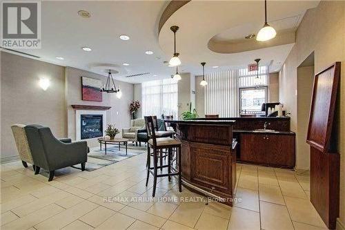 106 - 19 Barberry Place, Toronto, ON - Indoor Photo Showing Other Room With Fireplace