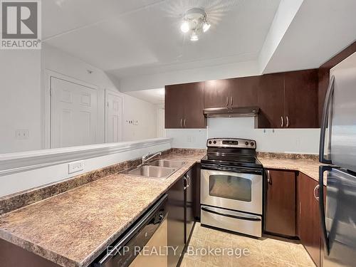 204 - 1350 Main Street E, Milton, ON - Indoor Photo Showing Kitchen With Stainless Steel Kitchen With Double Sink