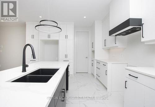 Kitchen now with appliance - 2286 Wickerson Road, London, ON - Indoor Photo Showing Kitchen With Double Sink