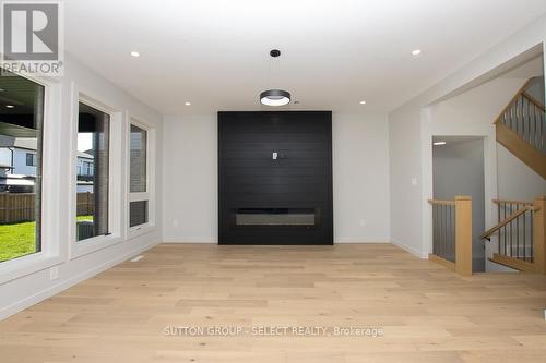 Electric fireplace in greatroom - 2286 Wickerson Road, London, ON - Indoor Photo Showing Other Room