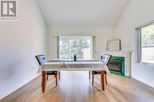 12 - 4275 Millcroft Park Drive, Burlington, ON - Indoor Photo Showing Dining Room With Fireplace