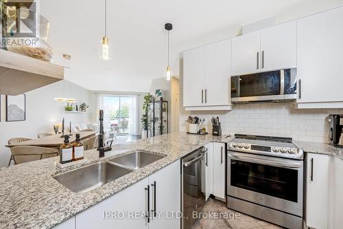 310 - 383 Main Street E, Milton, ON - Indoor Photo Showing Kitchen With Stainless Steel Kitchen With Double Sink With Upgraded Kitchen