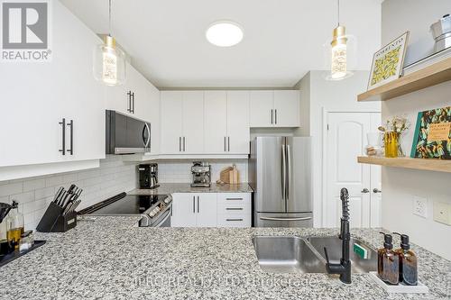 310 - 383 Main Street E, Milton, ON - Indoor Photo Showing Kitchen With Stainless Steel Kitchen With Upgraded Kitchen