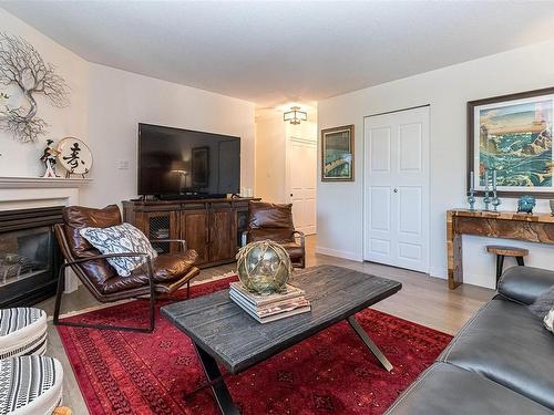 101-1685 Estevan Rd, Nanaimo, BC - Indoor Photo Showing Living Room With Fireplace