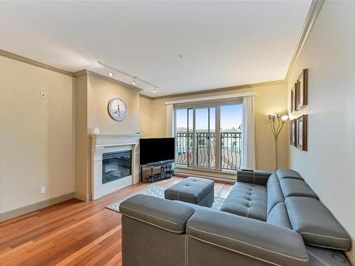 318-1620 Mckenzie Ave, Saanich, BC - Indoor Photo Showing Living Room With Fireplace