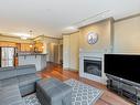 318-1620 Mckenzie Ave, Saanich, BC  - Indoor Photo Showing Living Room With Fireplace 