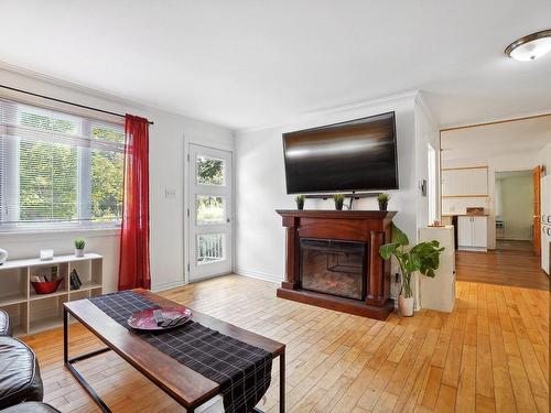 Living room - 2806 Rue Bourgie, Mascouche, QC - Indoor Photo Showing Living Room With Fireplace