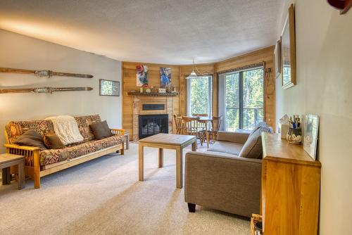 105-1191 Apex Mountain Road, Penticton, BC - Indoor Photo Showing Living Room With Fireplace