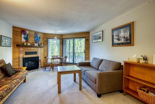 105-1191 Apex Mountain Road, Penticton, BC - Indoor Photo Showing Living Room With Fireplace