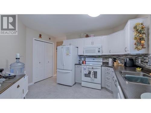 933 Harvey Avenue Unit# 101, Kelowna, BC - Indoor Photo Showing Kitchen With Double Sink