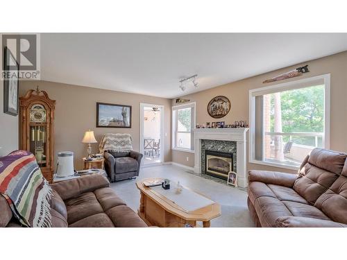 933 Harvey Avenue Unit# 101, Kelowna, BC - Indoor Photo Showing Living Room With Fireplace