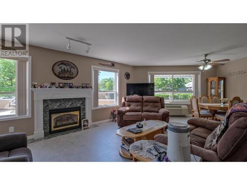 933 Harvey Avenue Unit# 101, Kelowna, BC - Indoor Photo Showing Living Room With Fireplace