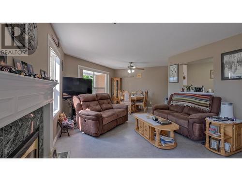 933 Harvey Avenue Unit# 101, Kelowna, BC - Indoor Photo Showing Living Room With Fireplace