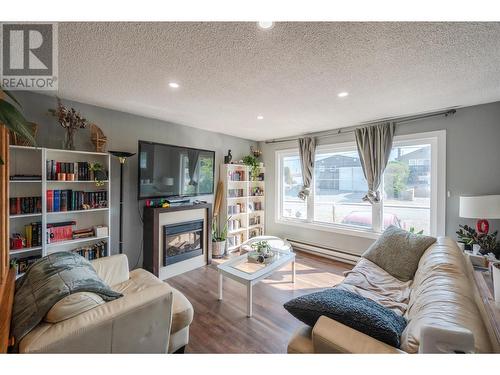 5806 89Th Street, Osoyoos, BC - Indoor Photo Showing Living Room With Fireplace