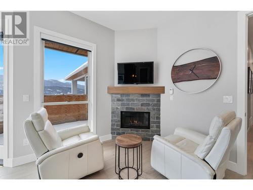 608 Mt Ida Crescent, Coldstream, BC - Indoor Photo Showing Living Room With Fireplace