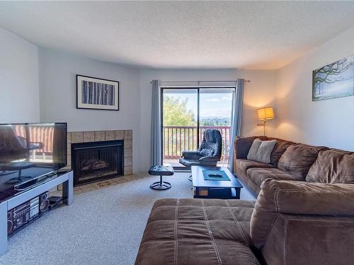 421-3255 Glasgow Ave, Saanich, BC - Indoor Photo Showing Living Room With Fireplace