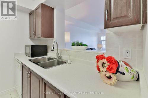 525 - 1883 Mcnicoll Avenue, Toronto (Steeles), ON - Indoor Photo Showing Kitchen With Double Sink