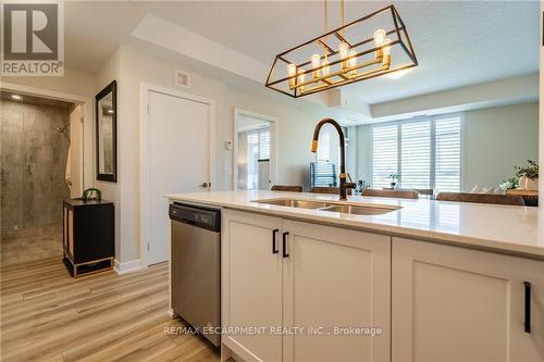 321 - 600 North Service Road, Hamilton (Lakeshore), ON - Indoor Photo Showing Kitchen With Double Sink