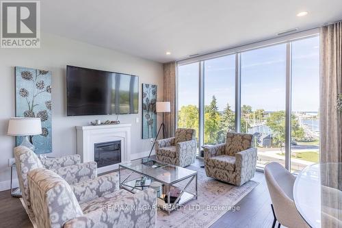 302 - 57 Lakeport Road, St. Catharines, ON - Indoor Photo Showing Living Room With Fireplace