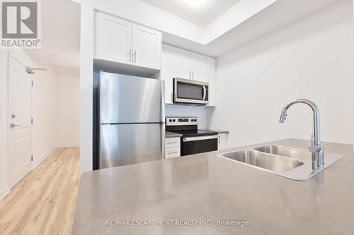 301 - 460 Dundas Street E, Hamilton (Waterdown), ON - Indoor Photo Showing Kitchen With Stainless Steel Kitchen With Double Sink With Upgraded Kitchen