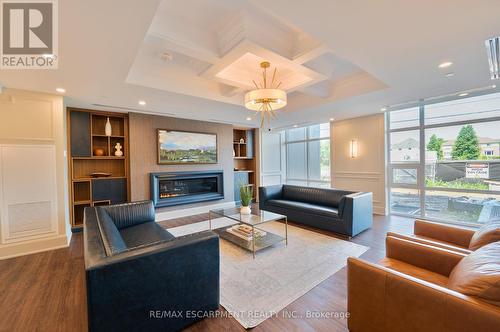 301 - 460 Dundas Street E, Hamilton (Waterdown), ON - Indoor Photo Showing Living Room With Fireplace