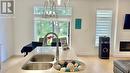 3898 Big Leaf Trail, London, ON  - Indoor Photo Showing Kitchen With Fireplace With Double Sink 