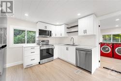 Kitchen with view into Laundry/Mud Room - 