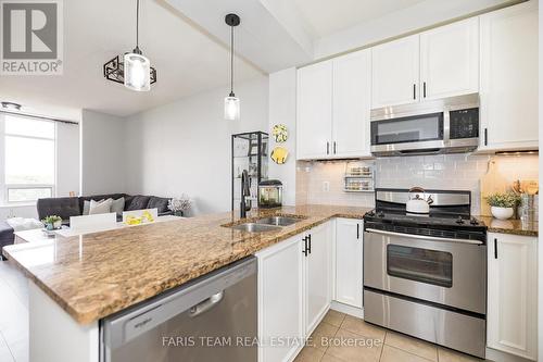 701 - 9235 Jane Street, Vaughan, ON - Indoor Photo Showing Kitchen With Double Sink