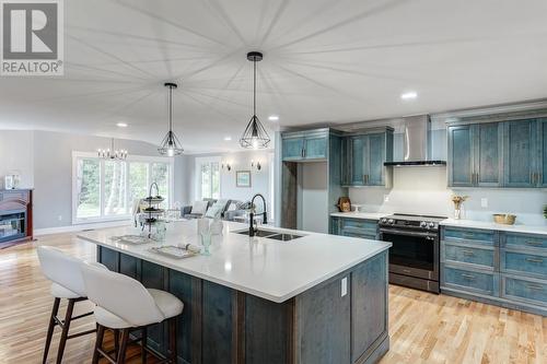 244 Main Road, Green'S Harbour, NL - Indoor Photo Showing Kitchen With Fireplace With Double Sink With Upgraded Kitchen