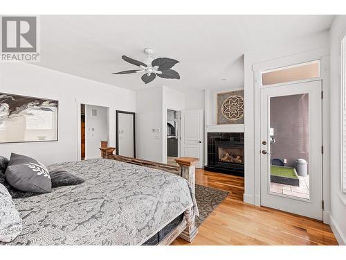 750 Marin Crescent, Kelowna, BC - Indoor Photo Showing Bedroom With Fireplace