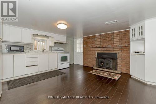 Lower - 158 Gilbert Avenue, Toronto (Corso Italia-Davenport), ON - Indoor Photo Showing Kitchen With Fireplace