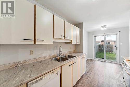 kitchen eating area walk's out to back - 127 Woodbury Crescent, Ottawa, ON - Indoor Photo Showing Kitchen With Double Sink