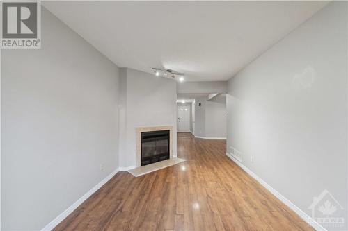 Fireplace in living room - 127 Woodbury Crescent, Ottawa, ON - Indoor With Fireplace