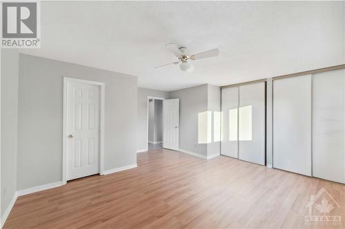 Primary bedroom with his and her closets and ensuite entrance. - 127 Woodbury Crescent, Ottawa, ON - Indoor Photo Showing Other Room