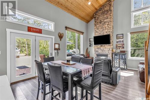 102 Moore Drive, Christopher Lake, SK - Indoor Photo Showing Dining Room With Fireplace