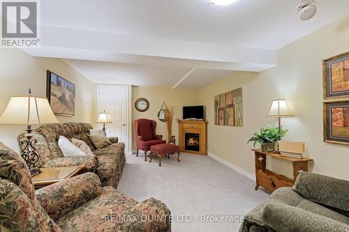 50 Elmdale Drive, Prince Edward County (Wellington), ON - Indoor Photo Showing Living Room With Fireplace