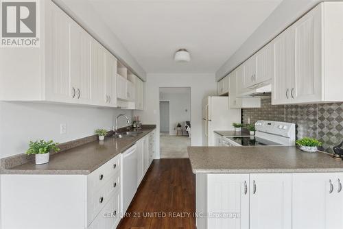 310 - 2183 Walker Avenue, Peterborough (Ashburnham), ON - Indoor Photo Showing Kitchen With Double Sink