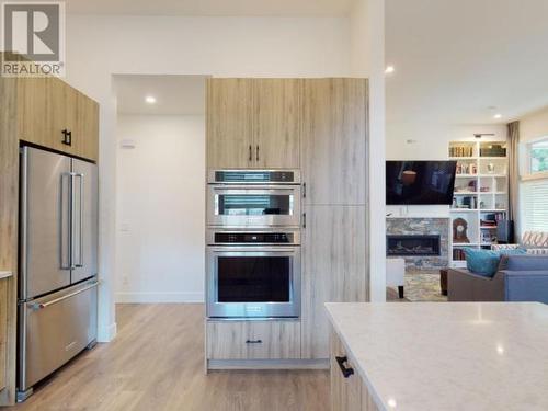 4048 Saturna Ave, Powell River, BC - Indoor Photo Showing Kitchen With Fireplace