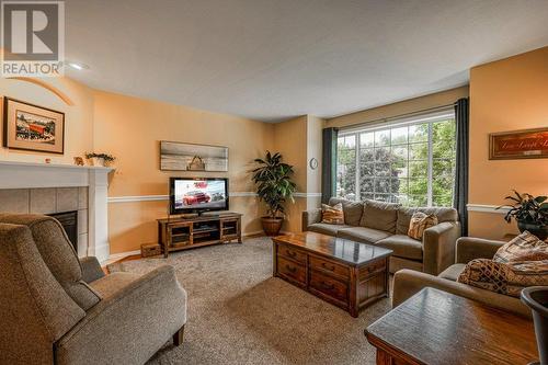 373 Rio Drive S, Kelowna, BC - Indoor Photo Showing Living Room With Fireplace